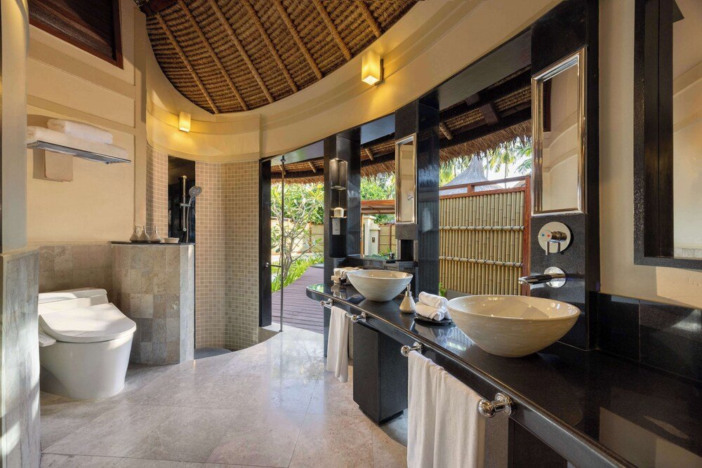 Modern bathroom with a large bathtub and double sink