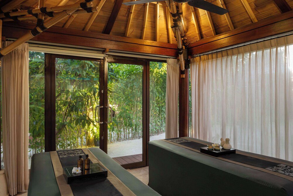 Room with a wooden ceiling and large windows