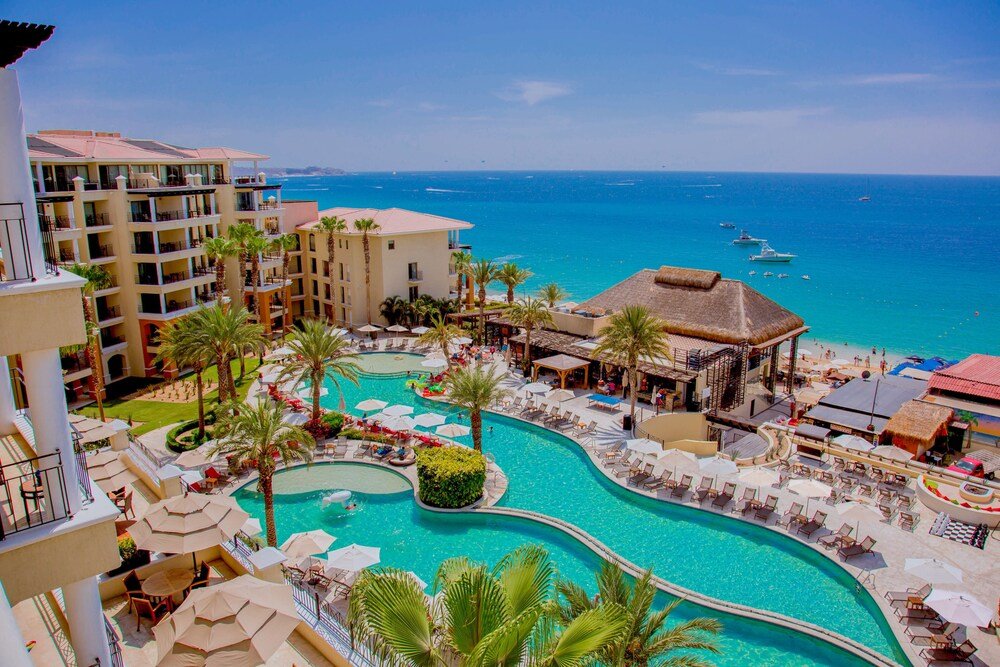 Resort with a large swimming pool and multiple balconies in Cabo San Lucas
