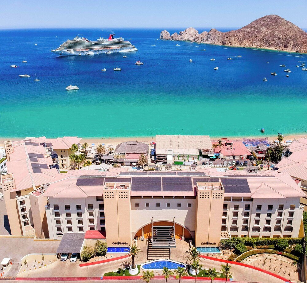 Coastal hotel with a large swimming pool next to the beach