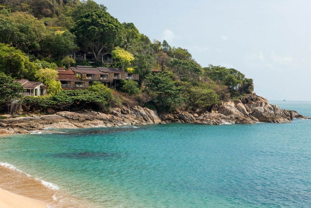 Coastal property with several houses on a hillside at Tongsai Bay