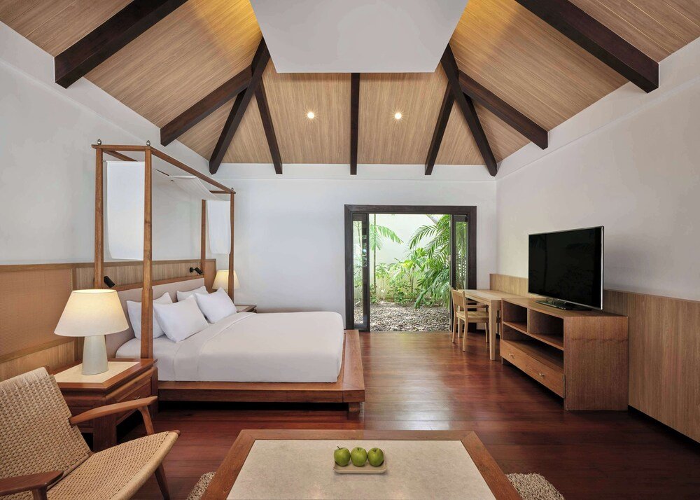 Modern bedroom with a four-poster bed at Garrya Tongsai Bay Samui