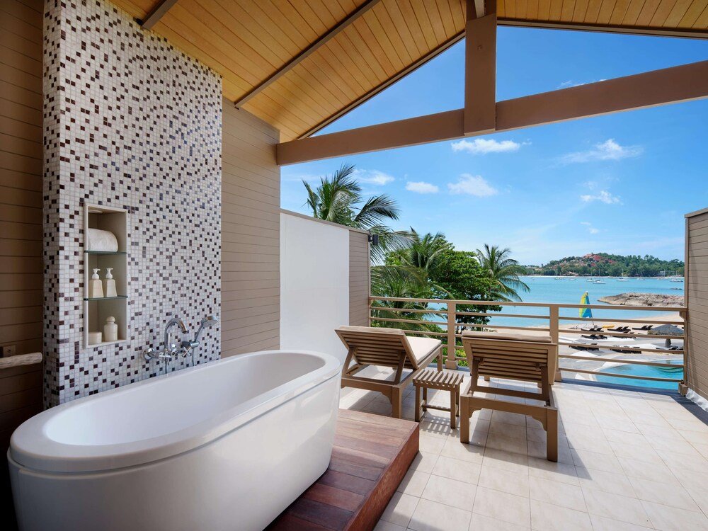 Bathroom with a freestanding bathtub at Garrya Tongsai Bay Samui