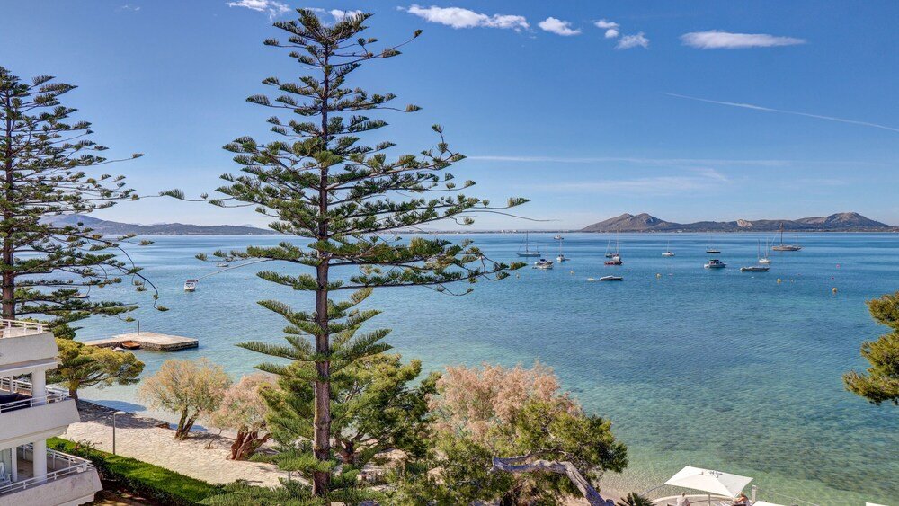 Coastal view with clear blue water and boats