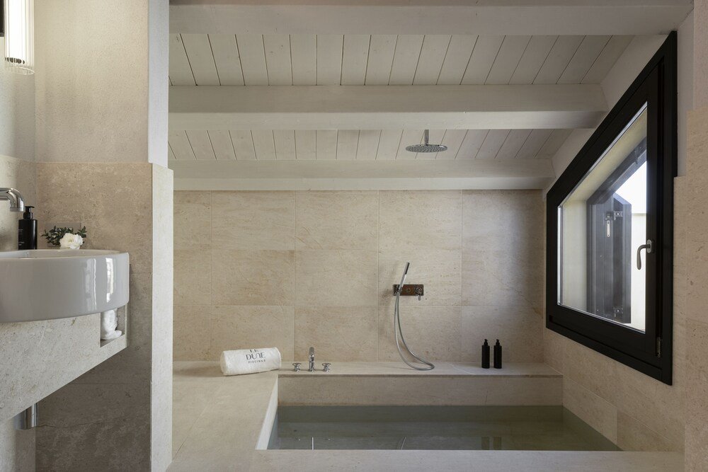 Modern bathroom with a bathtub and a shower