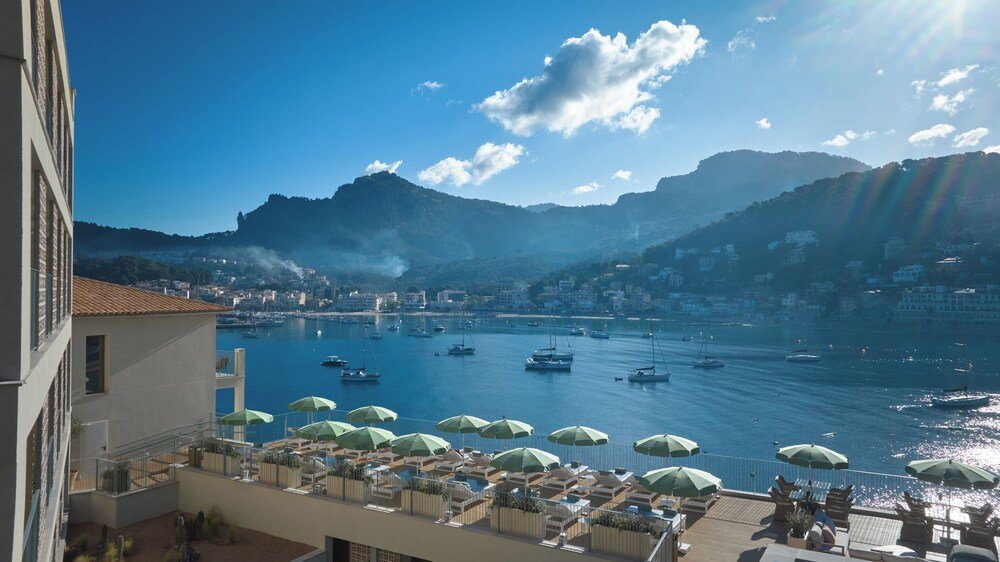 Coastal view with boats, a marina and a mountain