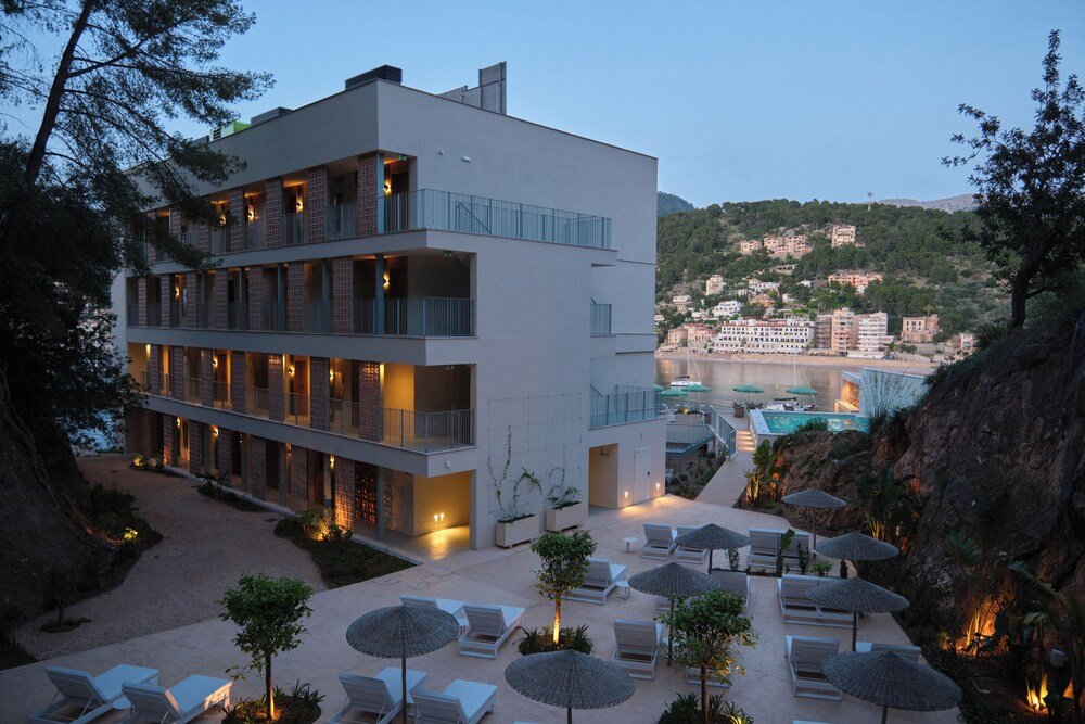 Modern hotel with several balconies and a pool area