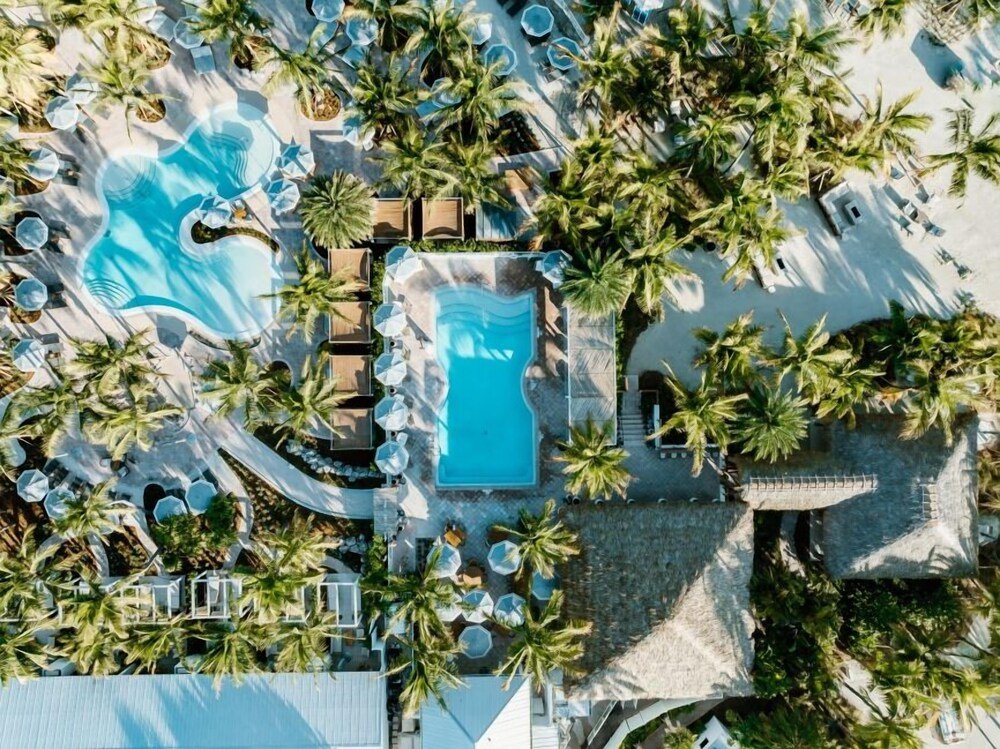 Aerial view of a resort with two swimming pools