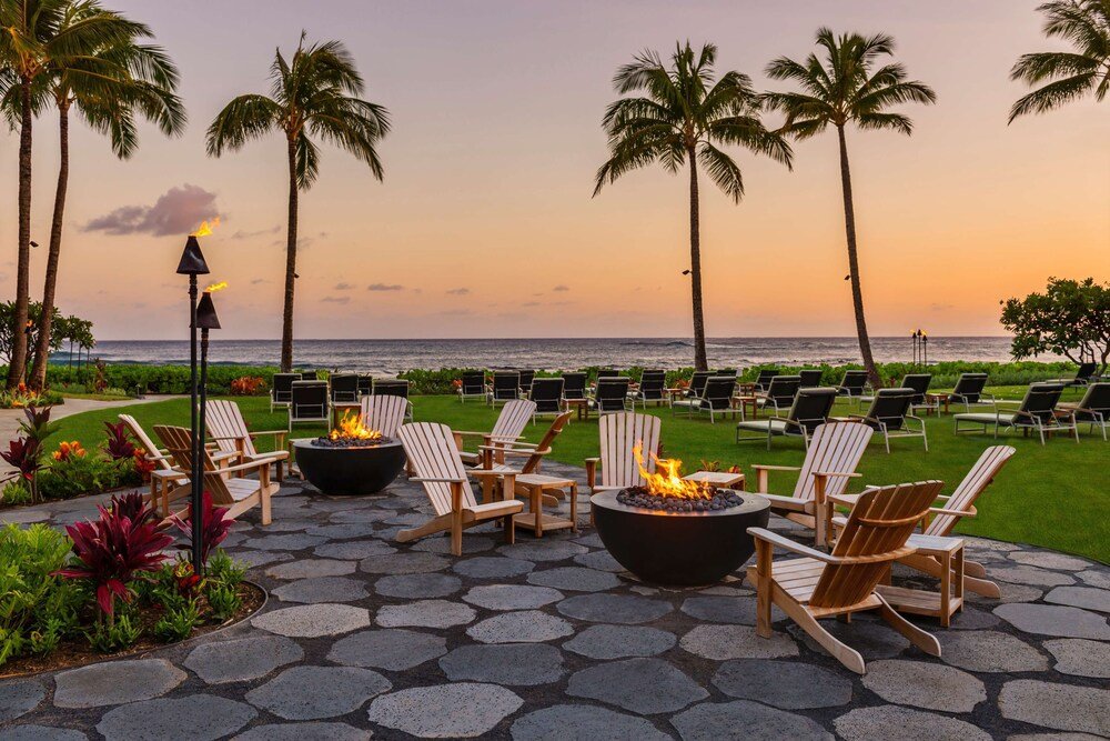 Patio with Adirondack chairs and a fire pit