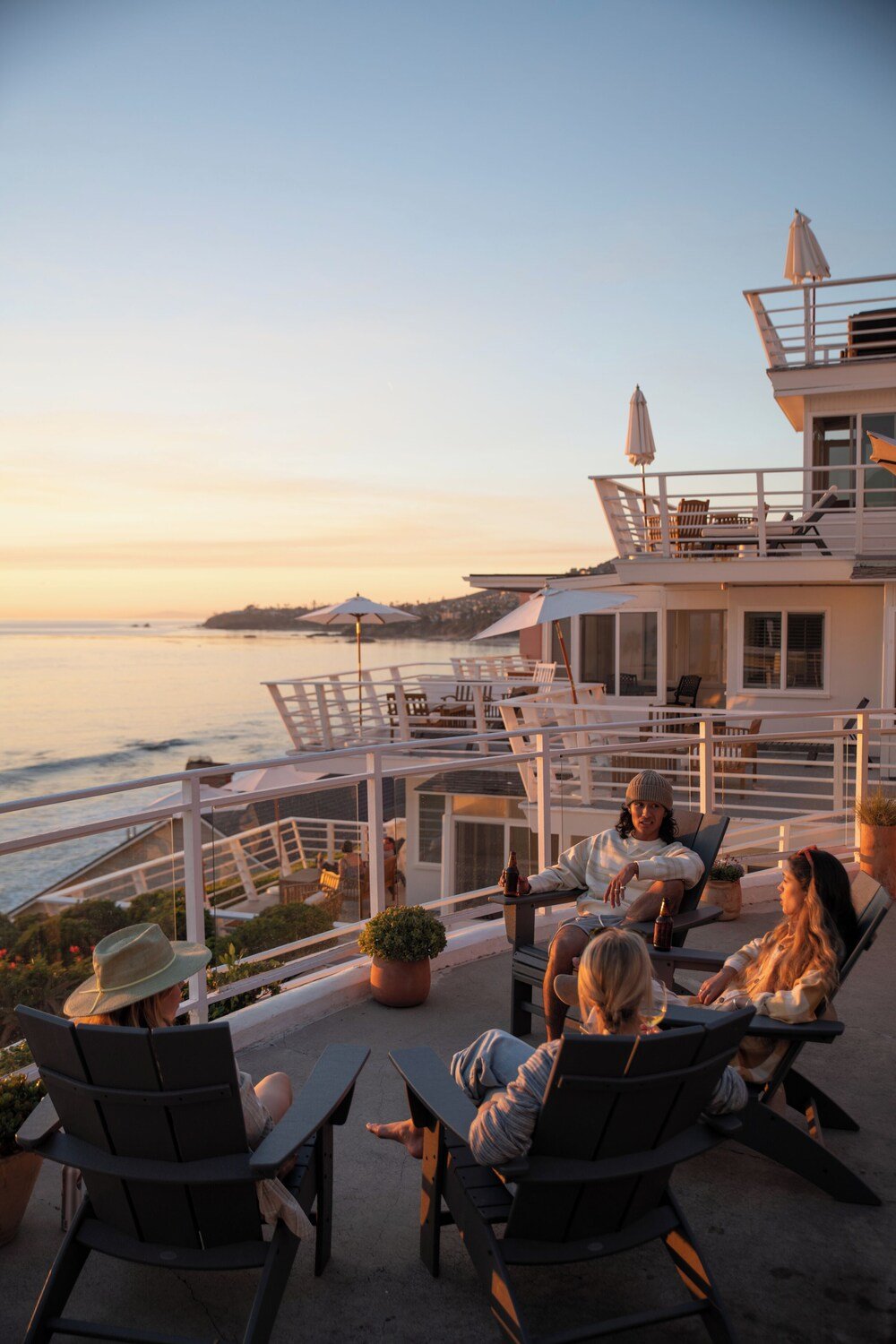 Terrace with outdoor seating overlooking the water at Laguna Surf Lodge