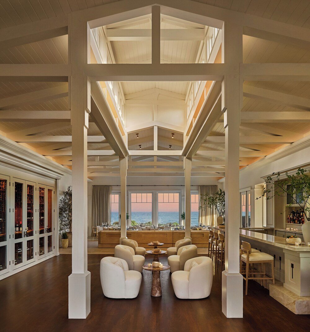 Spacious interior with a high ceiling and large windows