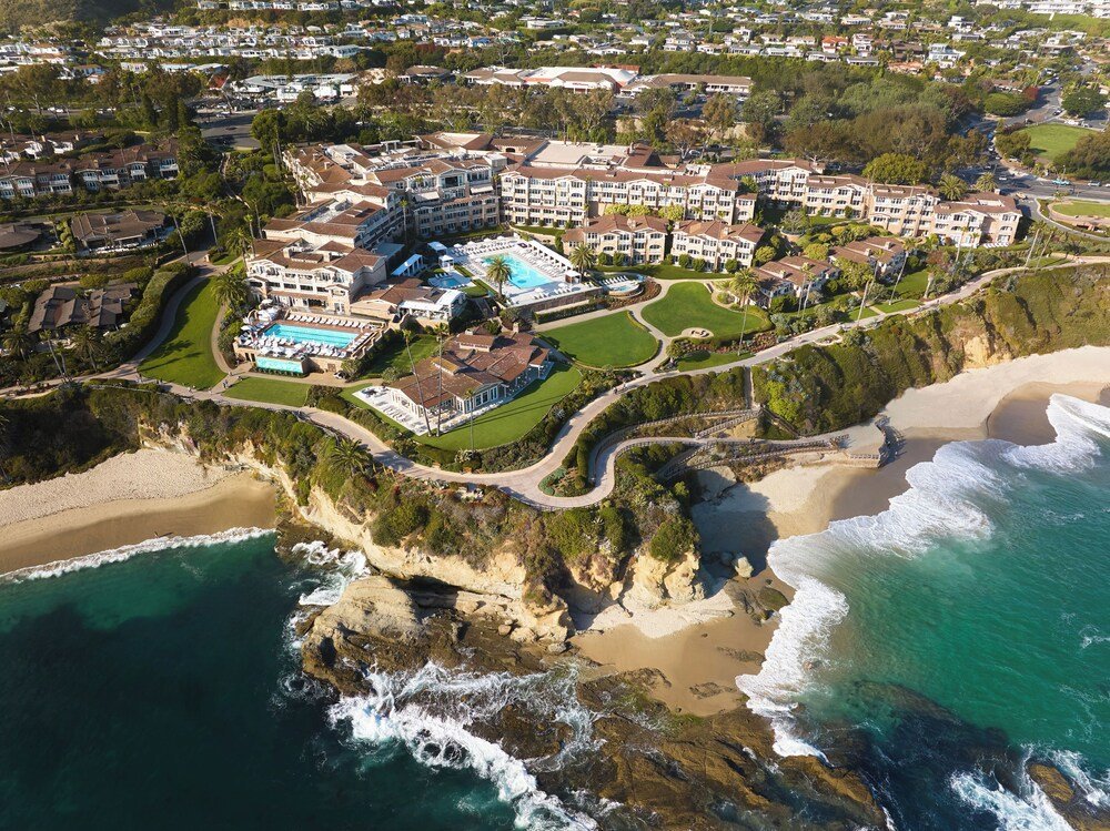 Aerial view of a coastal resort with multiple buildings