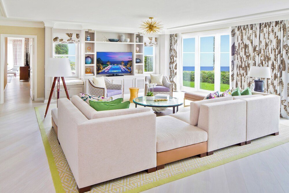 Modern living room with a large TV in a suite