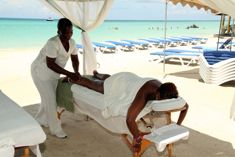 Massage therapy session on the beach