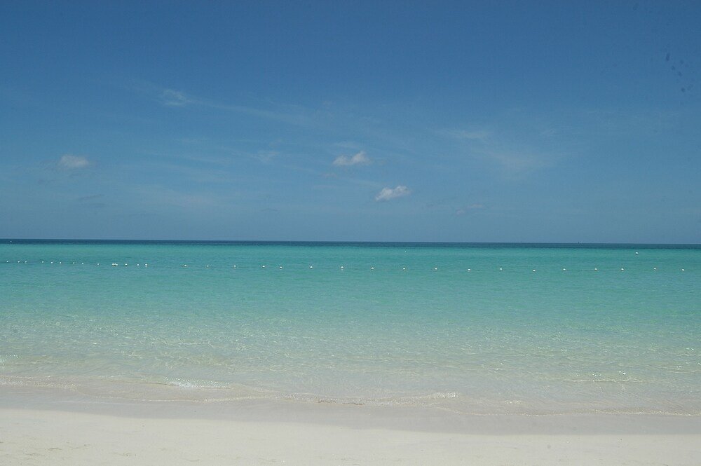 Beach with clear turquoise water and white sand