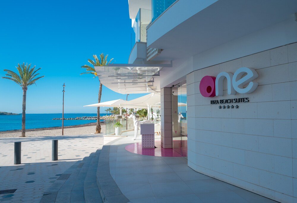 Modern hotel building with a sign at the entrance