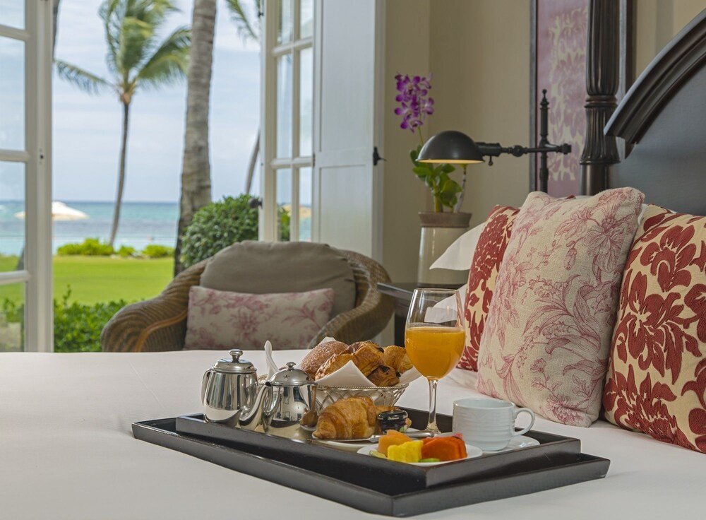 Breakfast tray with croissants and a coffee pot